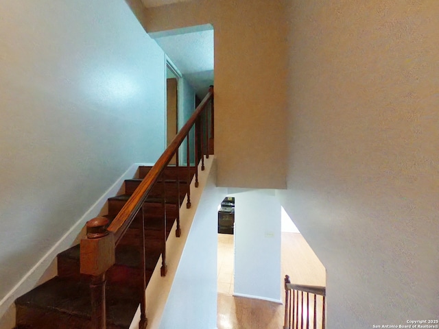 stairs with wood finished floors