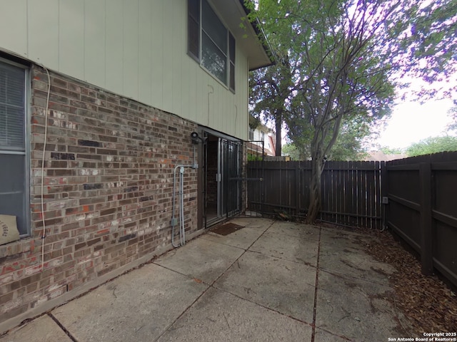 view of patio featuring fence