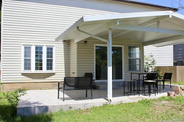 view of patio / terrace featuring fence and a wooden deck