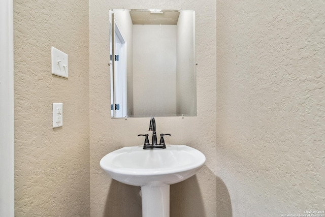 5103-5105 Flipper, San Antonio, TX 78238 - bathroom with a textured wall and a sink