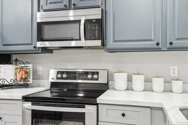 3654 Candlehead, San Antonio, TX 78244 - kitchen featuring appliances with stainless steel finishes and light stone countertops