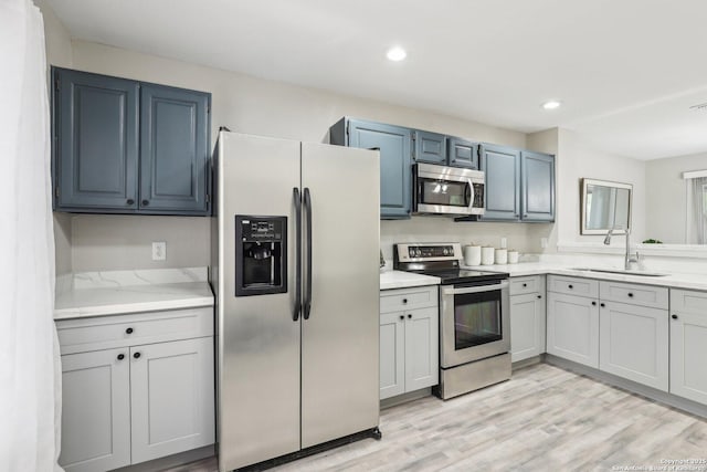 3654 Candlehead, San Antonio, TX 78244 - kitchen with light countertops, light wood-style floors, stainless steel appliances, and a sink
