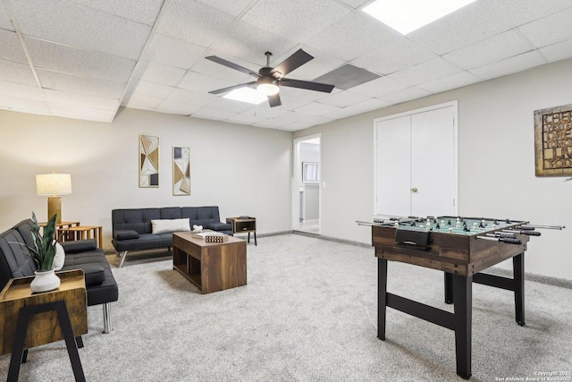 3654 Candlehead, San Antonio, TX 78244 - living area with ceiling fan, baseboards, light carpet, and a paneled ceiling