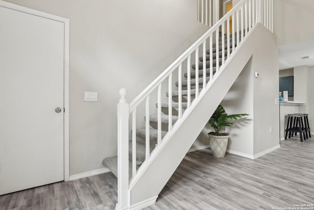 3654 Candlehead, San Antonio, TX 78244 - staircase with wood finished floors, visible vents, and baseboards