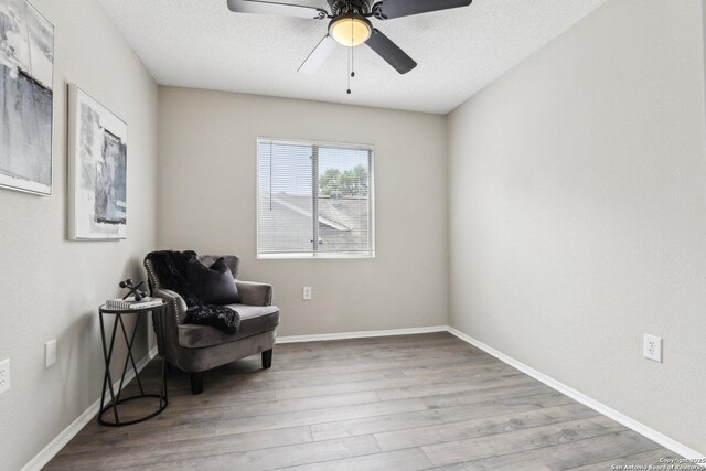 3654 Candlehead, San Antonio, TX 78244 - living area with baseboards, wood finished floors, and ceiling fan