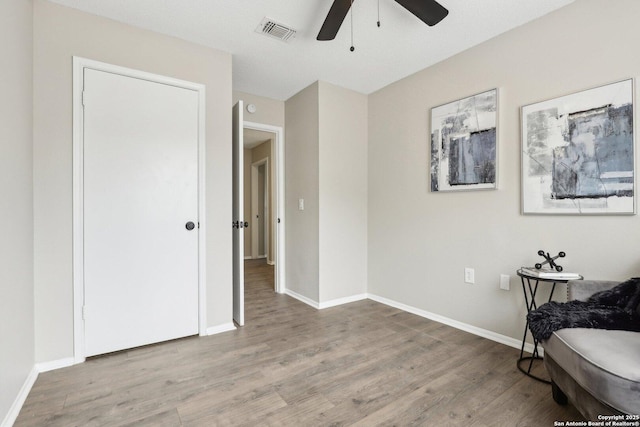 3654 Candlehead, San Antonio, TX 78244 - sitting room with baseboards, wood finished floors, visible vents, and ceiling fan