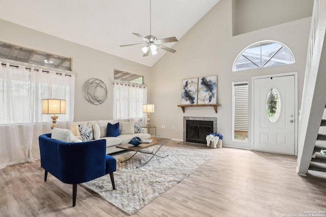 3654 Candlehead, San Antonio, TX 78244 - living room featuring ceiling fan, stairway, high vaulted ceiling, and wood finished floors
