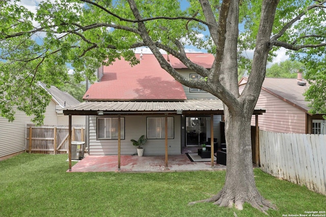 3654 Candlehead, San Antonio, TX 78244 - rear view of property featuring central AC unit, a fenced backyard, a yard, a patio area, and metal roof