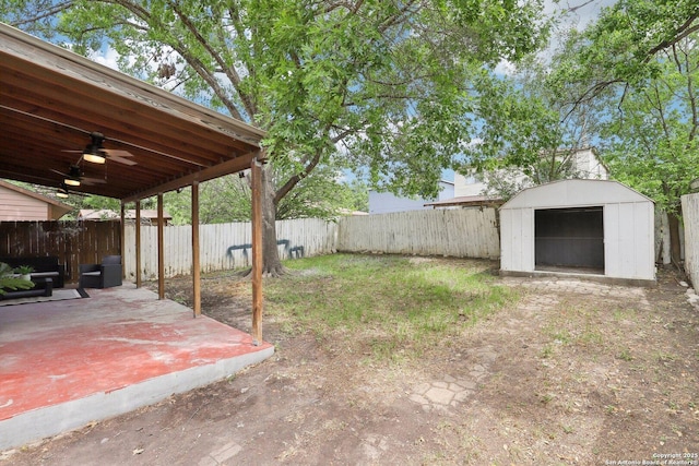 3654 Candlehead, San Antonio, TX 78244 - view of yard featuring a patio, a fenced backyard, a ceiling fan, and a shed