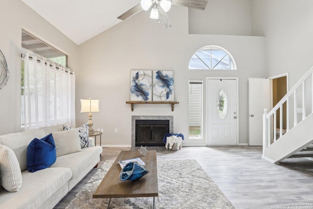 3654 Candlehead, San Antonio, TX 78244 - living room with high vaulted ceiling, stairway, wood finished floors, a fireplace with flush hearth, and a healthy amount of sunlight