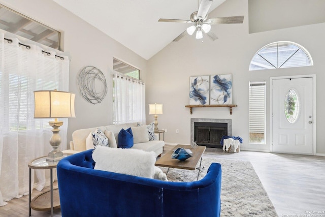3654 Candlehead, San Antonio, TX 78244 - living area with wood finished floors, a ceiling fan, baseboards, a fireplace, and high vaulted ceiling
