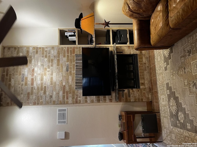unfurnished living room with visible vents