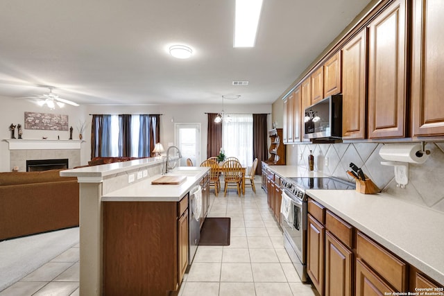 711 Point Spgs, San Antonio, TX 78253 - kitchen with appliances with stainless steel finishes, backsplash, a sink, visible vents, and light tile patterned flooring