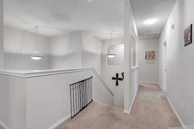 711 Point Spgs, San Antonio, TX 78253 - hallway with baseboards, visible vents, an upstairs landing, and carpet floors