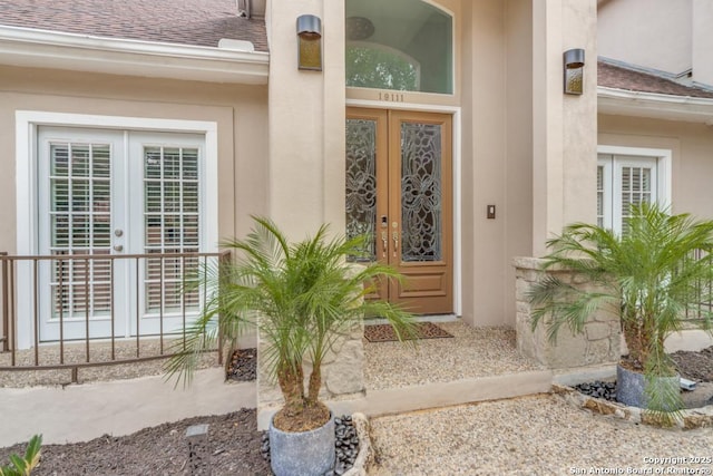 19111 Nature Oaks, San Antonio, TX 78258 - entrance to property with french doors, roof with shingles, and stucco siding