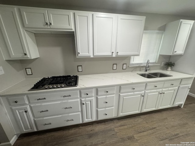 531 Cottonwood, San Antonio, TX 78225 - kitchen with stainless steel gas stovetop, dark wood finished floors, white cabinetry, and a sink