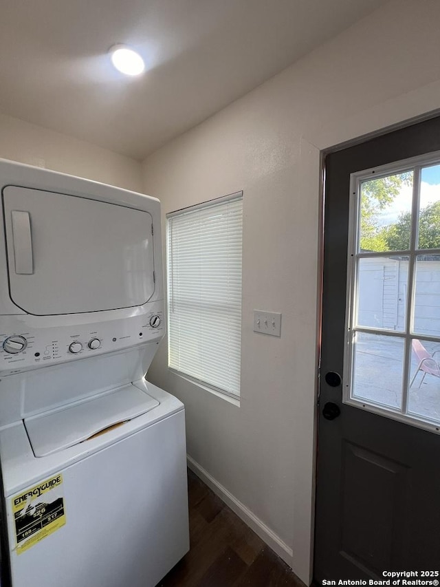 3108 Vera Cruz, San Antonio, TX 78207 - laundry area with baseboards, laundry area, stacked washing maching and dryer, and dark wood-type flooring