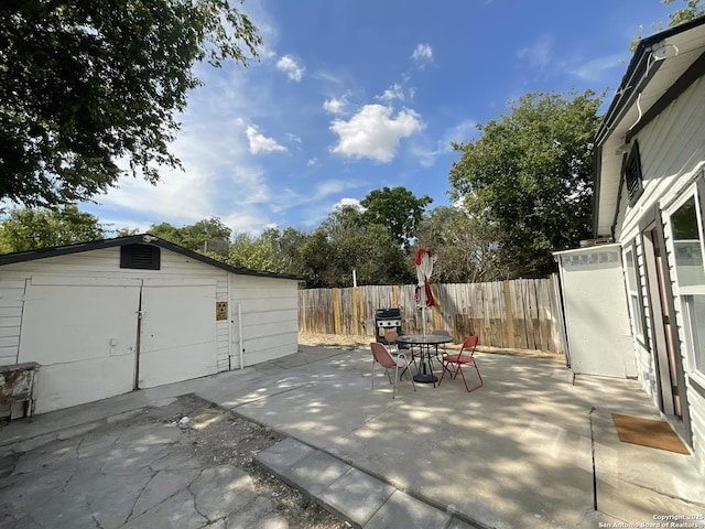 3108 Vera Cruz, San Antonio, TX 78207 - view of patio / terrace with a fenced backyard, an outdoor structure, and outdoor dining area