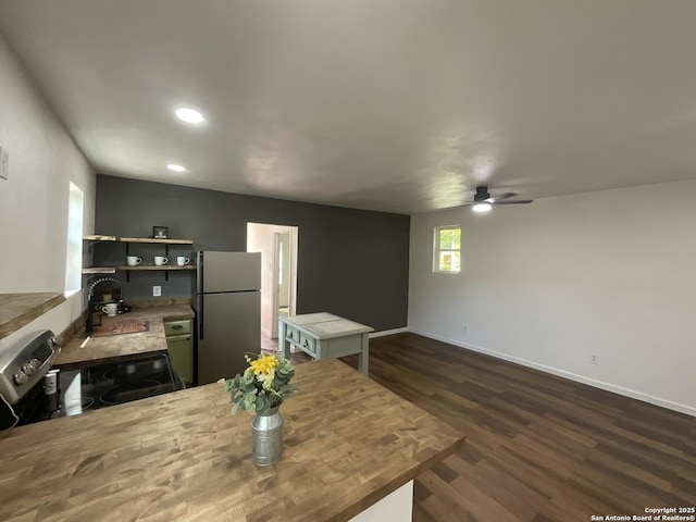3108 Vera Cruz, San Antonio, TX 78207 - kitchen featuring dark wood-style floors, stainless steel appliances, open shelves, baseboards, and ceiling fan