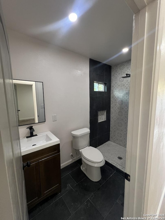 3108 Vera Cruz, San Antonio, TX 78207 - full bath with recessed lighting, a tile shower, tile patterned flooring, toilet, and vanity