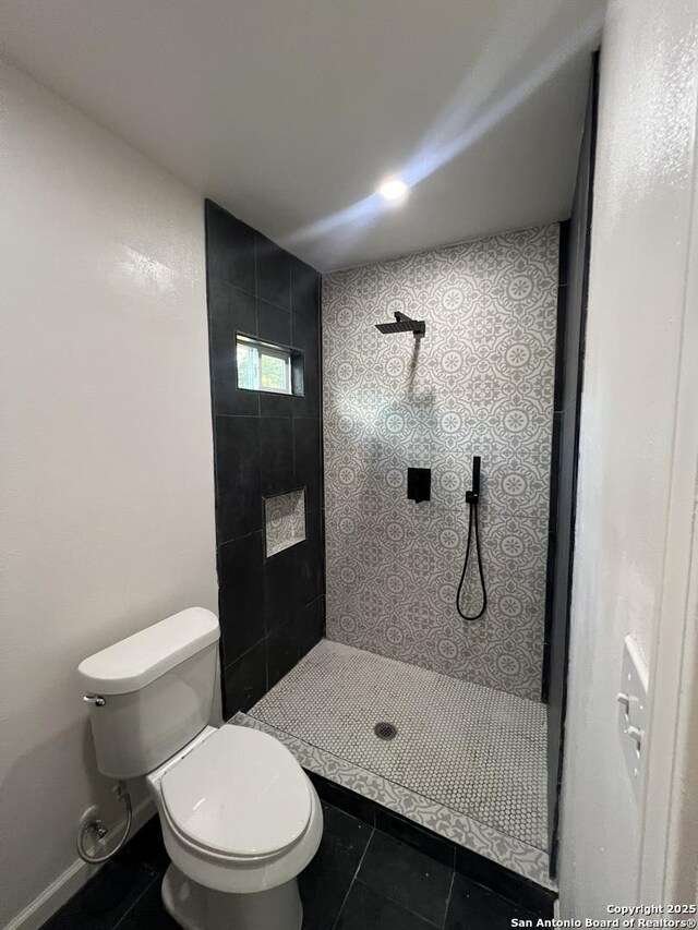 3108 Vera Cruz, San Antonio, TX 78207 - full bath with tile patterned floors, tiled shower, and toilet