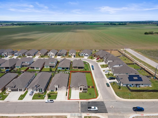 birds eye view of property with a residential view