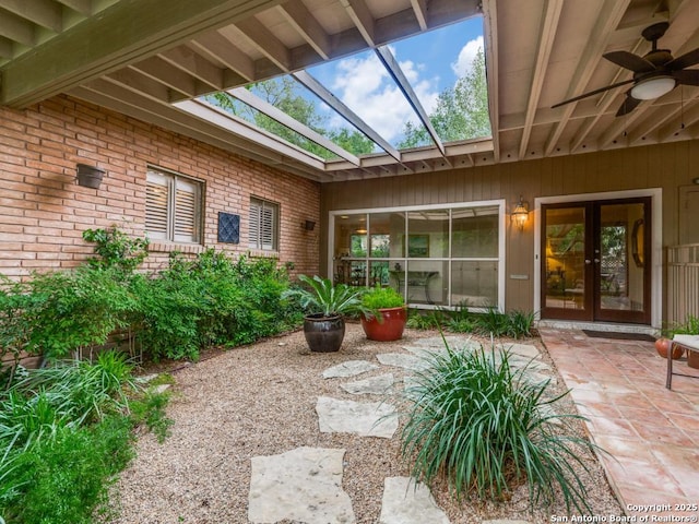 exterior space featuring french doors, a patio area, and ceiling fan