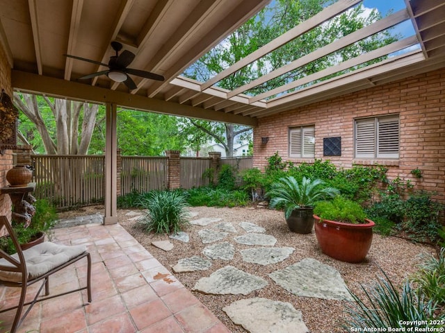 view of patio featuring ceiling fan, a fenced backyard, and a pergola
