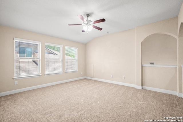 empty room with baseboards, a ceiling fan, and carpet flooring
