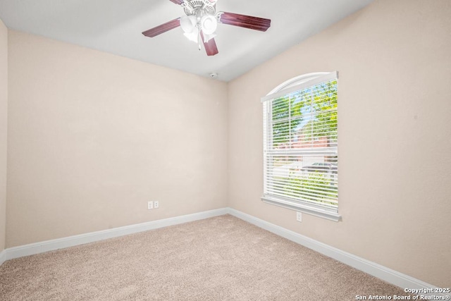unfurnished room with carpet, baseboards, and ceiling fan