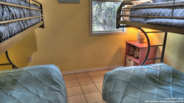 tiled bedroom with baseboards