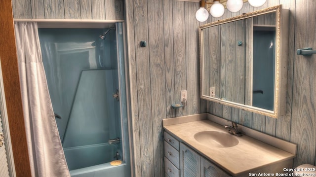 bathroom with shower / tub combo and vanity