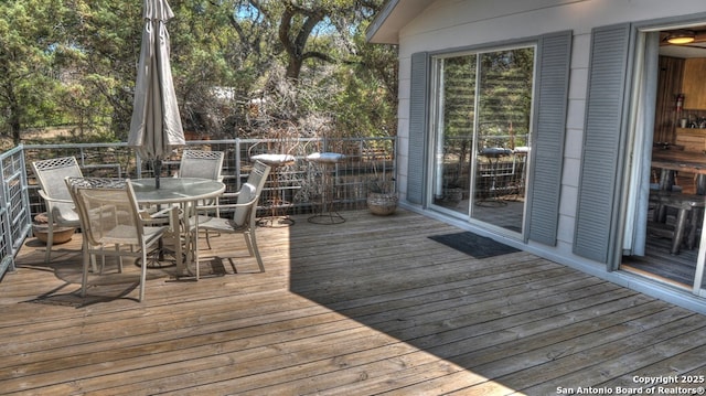 deck with outdoor dining space
