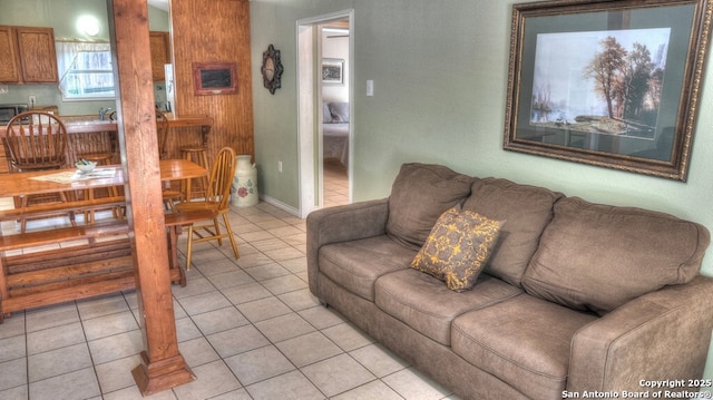 living area featuring light tile patterned flooring
