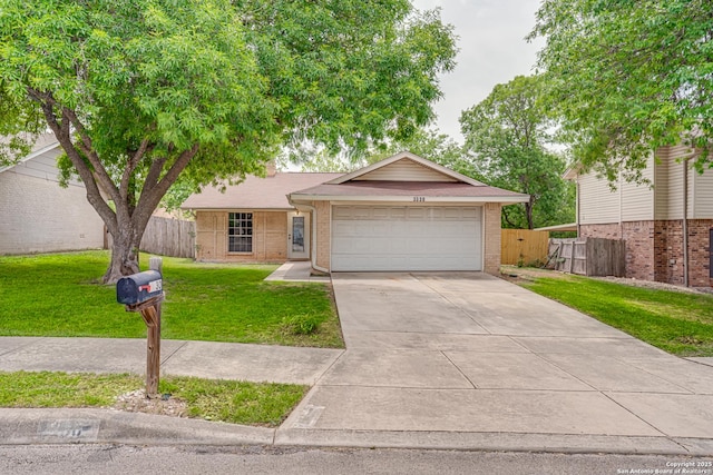 ranch-style house with fence, driveway, and brick siding