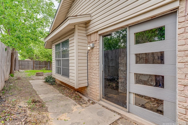 property entrance featuring fence
