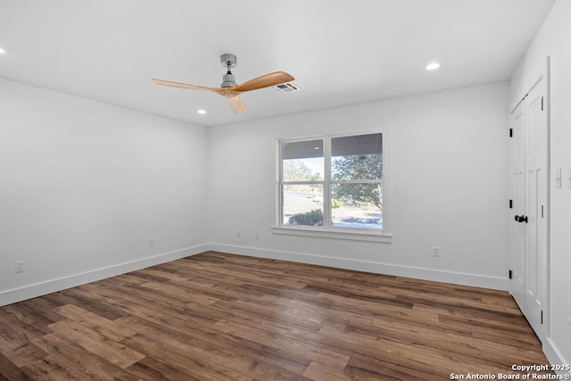 spare room featuring ceiling fan, baseboards, wood finished floors, and recessed lighting