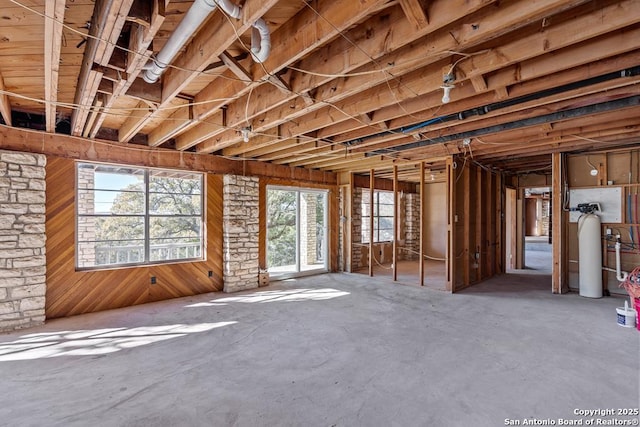 miscellaneous room featuring wood walls