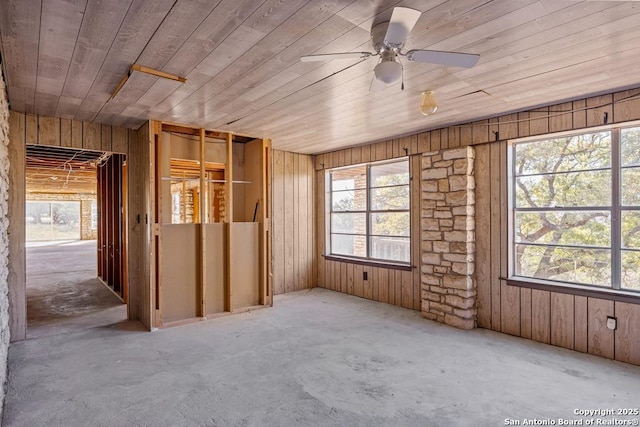 unfurnished room with wood ceiling and ceiling fan
