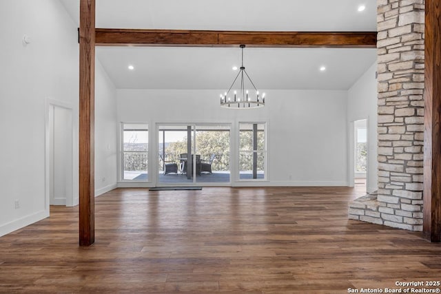 unfurnished living room featuring high vaulted ceiling, a chandelier, baseboards, beam ceiling, and dark wood-style floors