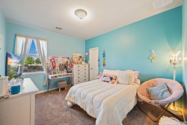 bedroom featuring baseboards, visible vents, and carpet