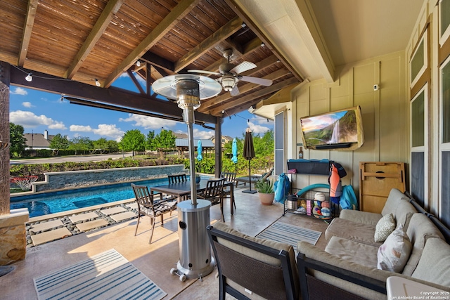 view of patio / terrace with outdoor lounge area, an outdoor pool, and ceiling fan