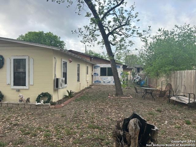 404 W Polk, Sabinal, TX 78881 - exterior space with concrete block siding and fence