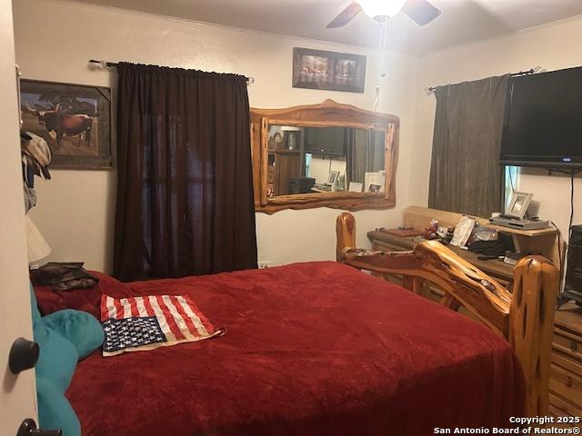 404 W Polk, Sabinal, TX 78881 - bedroom featuring ceiling fan