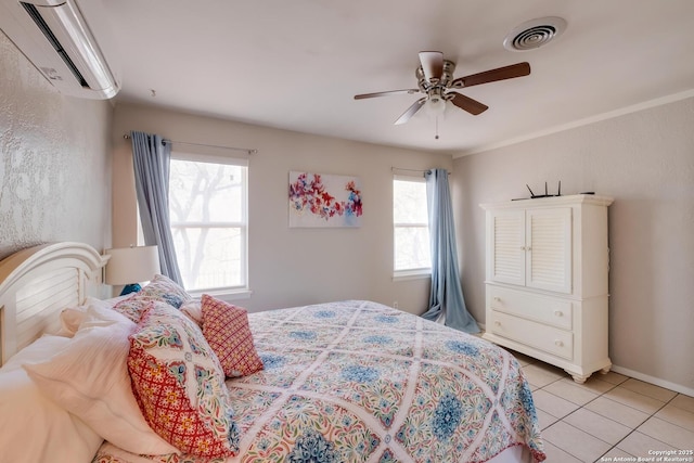 706 Gloria, Seguin, TX 78155 - bedroom with a wall mounted air conditioner, light tile patterned flooring, ceiling fan, baseboards, and visible vents