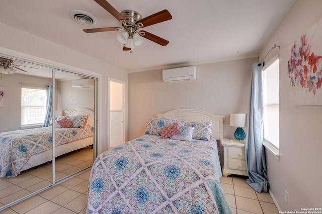 706 Gloria, Seguin, TX 78155 - bedroom with light tile patterned flooring, a wall mounted air conditioner, visible vents, and ceiling fan