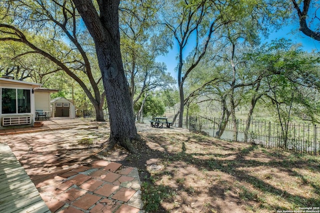 706 Gloria, Seguin, TX 78155 - view of yard featuring fence, an outbuilding, a patio area, and a storage shed