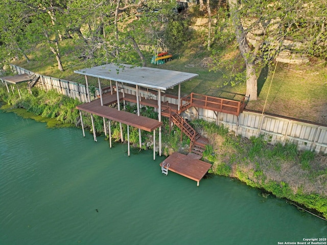 706 Gloria, Seguin, TX 78155 - view of play area with stairs, a boat dock, and a water view