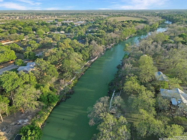 706 Gloria, Seguin, TX 78155 - drone / aerial view with a water view and a wooded view