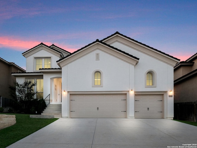 16106 Salto Del Agua, San Antonio, TX 78255 - view of front of home featuring concrete driveway, stucco siding, a tiled roof, and a garage